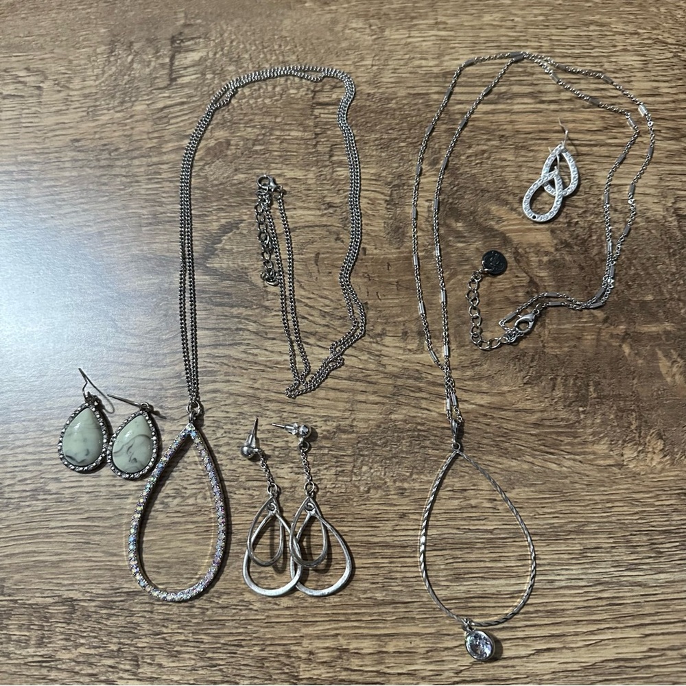 2 long silver necklaces and 3 pair earrings